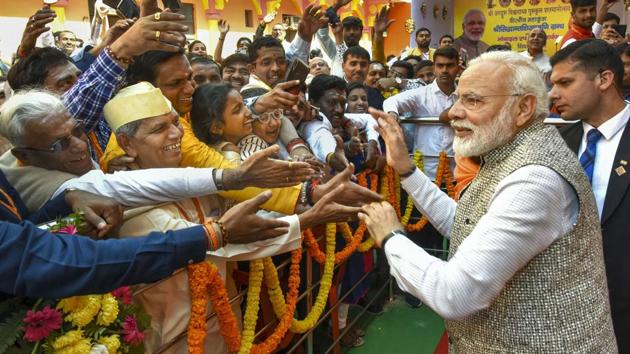 Prime Minister Narendra Modi meets people at the closing ceremony of the centenary celebrations of Shri Jagadguru Vishwaradhya Gurukul at Jangamwadi Math in Varanasi on Sunday. (PTI PHOTO.) Prime Minister Narendra Modi meets people at the closing ceremony of the centenary celebrations of Shri Jagadguru Vishwaradhya Gurukul at Jangamwadi Math in Varanasi on Sunday. (PTI PHOTO.)