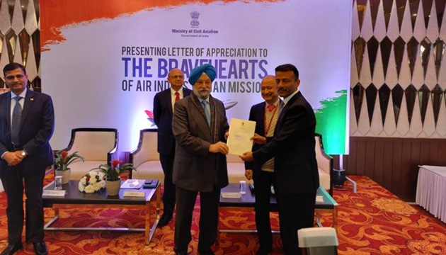 Aviation Minister Hardeep Singh Puri handed over the letters of appreciation to each crew member in a ceremony held in New Delhi, Feb 17, 2020. (Air India / Twitter) Aviation Minister Hardeep Singh Puri handed over the letters of appreciation to each crew member in a ceremony held in New Delhi, Feb 17, 2020. (Air India / Twitter)
