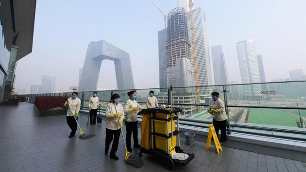 Workers clean a shopping mall, in Beijing's central business district. A surge in China’s reported cases does not indicate a wider epidemic, the World Health Organization said last week. “This is not a sign that the outbreak is suddenly exploding,” said WHO official Simeon Bennett. “We see no significant change in the trajectory of the outbreak.” (China Daily via REUTERS)