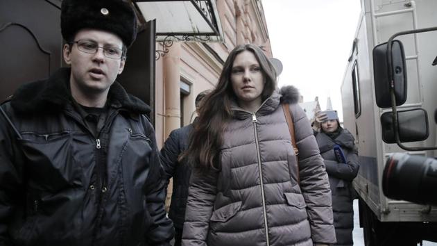Alla Ilyina, who broke out of the hospital on Feb. 7 after learning that she would have to spend 14 days in isolation instead of the 24 hours doctors promised her, is escorted by a bailiffs form a court after a session in St.Petersburg, Russia. (AP) Alla Ilyina, who broke out of the hospital on Feb. 7 after learning that she would have to spend 14 days in isolation instead of the 24 hours doctors promised her, is escorted by a bailiffs form a court after a session in St.Petersburg, Russia. (AP)