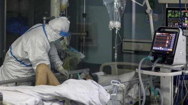 A doctor checks on the conditions of a patient in Jinyintan Hospital, designated for critical COVID-19 patients, in Wuhan in central China's Hubei province Thursday, Feb. 13, 2020. (AP) A doctor checks on the conditions of a patient in Jinyintan Hospital, designated for critical COVID-19 patients, in Wuhan in central China's Hubei province Thursday, Feb. 13, 2020. (AP)