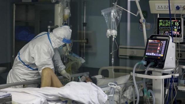 A doctor checks on the conditions of a patient in Jinyintan Hospital, designated for critical COVID-19 patients, in Wuhan in central China's Hubei province Thursday, Feb. 13, 2020. (AP) A doctor checks on the conditions of a patient in Jinyintan Hospital, designated for critical COVID-19 patients, in Wuhan in central China's Hubei province Thursday, Feb. 13, 2020. (AP)