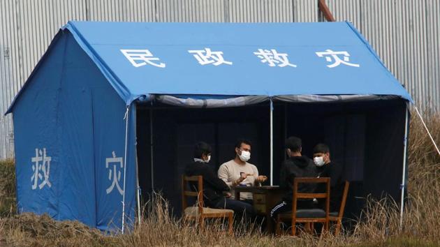 Men play cards inside the quarantine center after their arrival from coronavirus-stricken Chinese city of Wuhan in Bhaktapur, Nepal. (REUTERS) Men play cards inside the quarantine center after their arrival from coronavirus-stricken Chinese city of Wuhan in Bhaktapur, Nepal. (REUTERS)