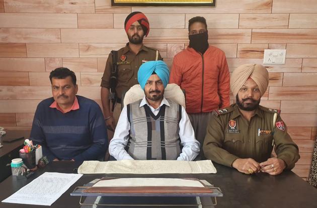 The accused (face covered) in police custody in Ludhiana. (HT PHOTO) The accused (face covered) in police custody in Ludhiana. (HT PHOTO)