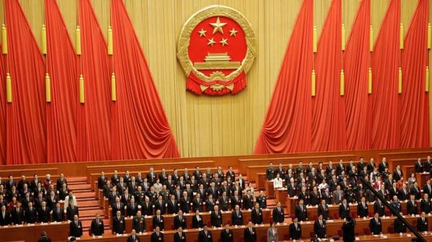 Officials sing the national anthem at the closing session of the National People's Congress (NPC) at the Great Hall of the People in Beijing, China. (REUTERS) Officials sing the national anthem at the closing session of the National People's Congress (NPC) at the Great Hall of the People in Beijing, China. (REUTERS)