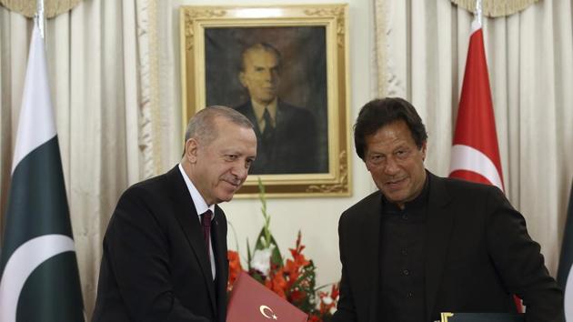 Turkey's President Recep Tayyip Erdogan, left, and Pakistan Prime Minister Imran Khan shake hands after signing of several agreements, in Islamabad, Pakistan. (AP) Turkey's President Recep Tayyip Erdogan, left, and Pakistan Prime Minister Imran Khan shake hands after signing of several agreements, in Islamabad, Pakistan. (AP)