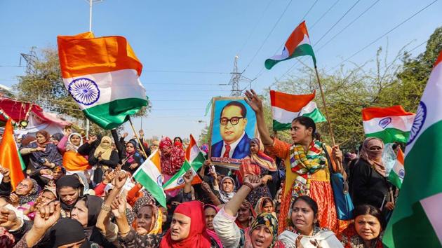 New Delhi: Women wave tricolours during their ongoing protest against CAA and NRC at Shaheen Bagh in New Delhi. SC court said that protesters have a right to protest but they cannot block roads.(PTI) New Delhi: Women wave tricolours during their ongoing protest against CAA and NRC at Shaheen Bagh in New Delhi. SC court said that protesters have a right to protest but they cannot block roads.(PTI)