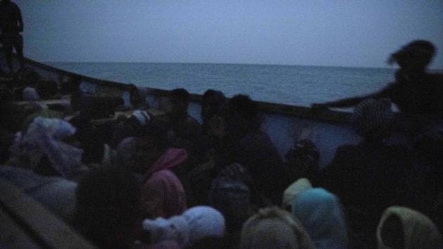 The smugglers had hushed conversations on satellite phones with their counterparts in Yemen. There was a moment of worry when a black dinghy appeared–a patrol of Djibouti’s marines. After half an hour it motored away. The marines had received their daily bribe of around $100 dollars. The migrants were warned not to move or talk during the crossing. Most had never seen the sea before. (Nariman El-Mofty / AP)