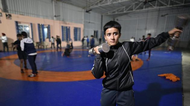 Just a few years earlier, this would have been unthinkable in Sonepat, where only the men in the family were free to go into wrestling, but not the women. Now the women here talk of their target—the Olympics. “I saw Sushil Kumar, and saw Sakshi didi win in Rio,” said Sonam. “Since then I have been working hard because I want to win a medal at the Olympics.” (Biplov Bhuyan / HT Photo)