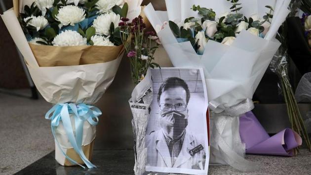 A makeshift memorial for Li Wenliang, a doctor who issued an early warning about the coronavirus outbreak before it was officially recognized, is seen after Li died of the virus, at an entrance to the Central Hospital of Wuhan on February 7. (REUTERS)