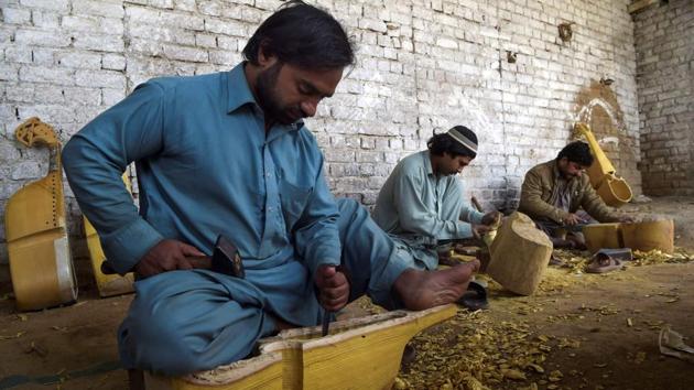 The slow creep of extremism started threatening traditional music in the 1970s as more hardline Islamist movements started gaining influence in the Pashtun areas along the border with Afghanistan, promoting strict interpretations of the religion including dismissive takes toward music. The shift towards violent extremism intensified with the 1979 Soviet invasion of Afghanistan and the later Taliban regime of the 1990s. (Abdul Majeed / AFP)