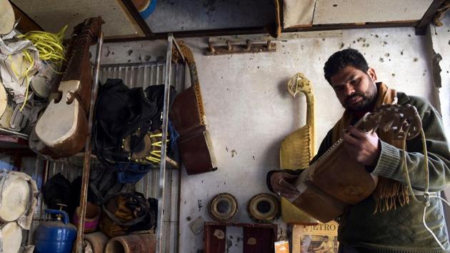 A worker checks a traditional rabab musical instrument in a workplace on the outskirts of Peshawar. As music has returned to its traditional settings in the country’s northwest, slick broadcasts like Coke Studio have helped introduce Pashtun acts to millions of music fans across South Asia. Many still remain cautious in Khyber Pakhtunkhwa, however, fearing the gains are tenuous at best. (Abdul Majeed / AFP)