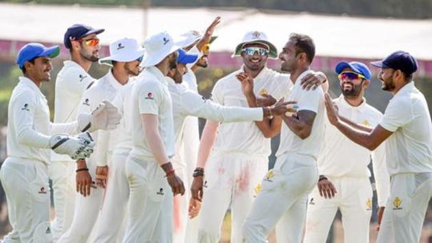 Karnataka bowler Mithun celebrates with his teammates (PTI) Karnataka bowler Mithun celebrates with his teammates (PTI)