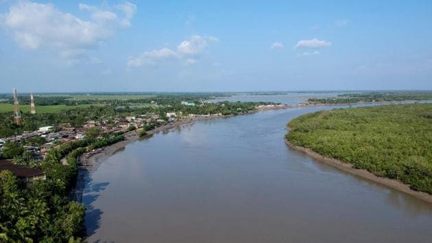A village in the Sundarbans. “Honey-hunters prefer to collect honey mostly in the southwestern Sundarbans, where most of the man-eaters (tigers) live,” leading Bengal tiger expert at Jahangirnagar University, Monirul Khan, told AFP. Tigers are an endangered species but climate change and human development is reducing their wild habitat, often forcing them towards villages in search of food. (Munir uz Zaman / AFP) A village in the Sundarbans. “Honey-hunters prefer to collect honey mostly in the southwestern Sundarbans, where most of the man-eaters (tigers) live,” leading Bengal tiger expert at Jahangirnagar University, Monirul Khan, told AFP. Tigers are an endangered species but climate change and human development is reducing their wild habitat, often forcing them towards villages in search of food. (Munir uz Zaman / AFP)