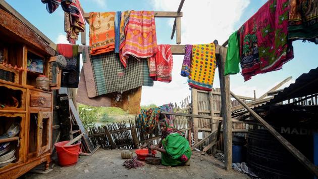 Mosammat Rashida, prepares a meal at her house in Shyamnagar, Bangladesh. Abandoned by her sons, shunned by her neighbours and branded a witch. Rashida’s crime? Her husband was killed by a Bengal tiger. Women like her are ostracised in many rural villages in Bangladesh, where they are viewed as the cause of their partner’s misfortune. (Munir uz Zaman / AFP) Mosammat Rashida, prepares a meal at her house in Shyamnagar, Bangladesh. Abandoned by her sons, shunned by her neighbours and branded a witch. Rashida’s crime? Her husband was killed by a Bengal tiger. Women like her are ostracised in many rural villages in Bangladesh, where they are viewed as the cause of their partner’s misfortune. (Munir uz Zaman / AFP)