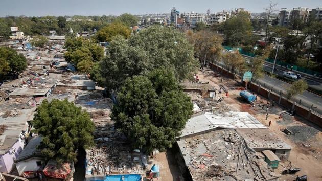 A view of the slum area where a wall was built along the roadshow route. Authorities in Ahmedabad expect to spend 80 crore on preparations for the visit by the American president that is likely to last around three hours, two government officials with direct knowledge of the plans told Reuters. (Amit Dave / REUTERS)