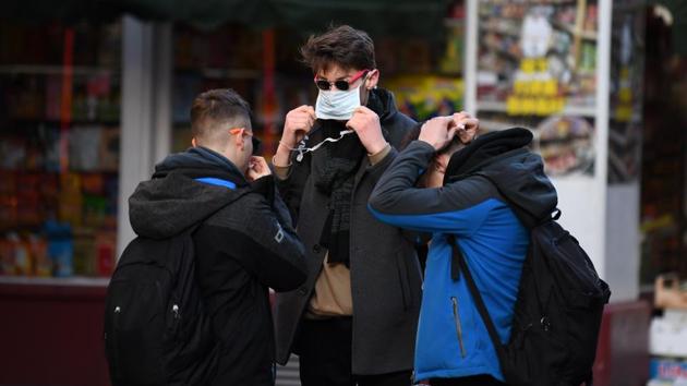 Tourists putting on face masks in London's Chinatown district. Many believe xenophobia has worsened the situation further. Fred Lo’s souvenir store in San Francisco is usually frequented by tourists from Europe and South America. But “for the past two weeks, there’s been a lot less people, at least 50% less, even though nobody is sick or has even been to China,” he told AFP. (Daniel Leal-Olivas / AFP)