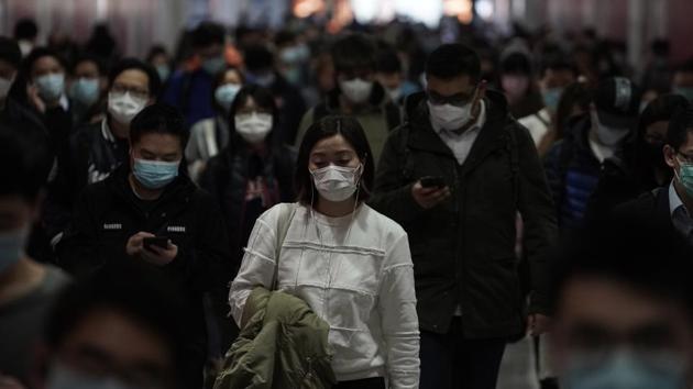 People wearing masks, walk in a subway station, in Hong Kong, Friday, Feb. 7, 2020.(AP file photo)