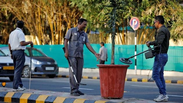 Members of a bomb disposal squad from Gujarat Police scan a plant pot on a road divider. Donald Trump will be making his first official trip to the world’s largest democracy. The leaders of China, Japan and Israel have all visited Ahmedabad since Narendra Modi became Prime Minister. (Amit Dave / REUTERS)