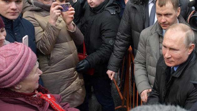 Russian President Vladimir Putin, right, speaks to members of the public in St. Petersburg, Russia, Wednesday, Feb. 19, 2020. (AP) Russian President Vladimir Putin, right, speaks to members of the public in St. Petersburg, Russia, Wednesday, Feb. 19, 2020. (AP)