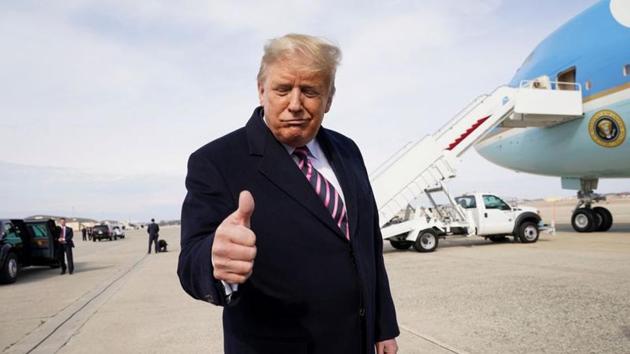 US President Donald Trump gestures to reporters as he departs Washington for campaign travel to California from Joint Base Andrews in Maryland, US.(REUTERS)