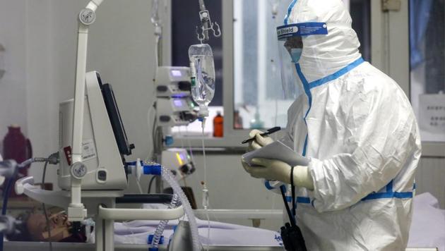 A medical worker records down a patient's condition at Jinyintan Hospital designated for new coronavirus infected patients, in Wuhan. (AP) A medical worker records down a patient's condition at Jinyintan Hospital designated for new coronavirus infected patients, in Wuhan. (AP)
