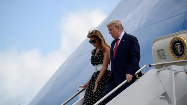 US President Donald Trump and first lady Melania Trump exit Air Force One in Florida, US. (REUTERS) US President Donald Trump and first lady Melania Trump exit Air Force One in Florida, US. (REUTERS)