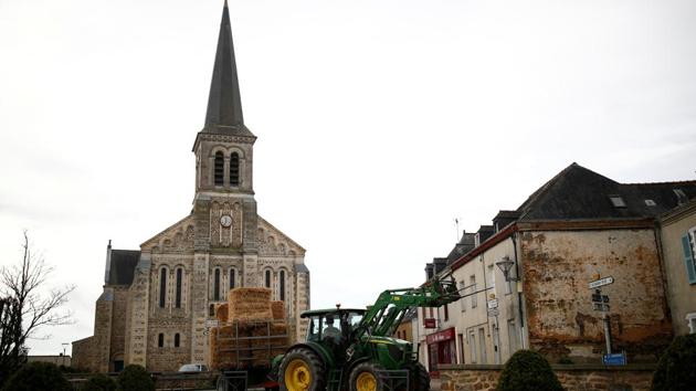 A French farmer drives his tractor in Congrier, France, February 15, 2020. Congrier, 900 inhabitants, is one of the first villages selected for the "1,000 cafes" project launched in France to save cafes in small villages in order to breathe life back in the community. Picture taken February 15, 2020. REUTERS/Stephane Mahe (REUTERS) A French farmer drives his tractor in Congrier, France, February 15, 2020. Congrier, 900 inhabitants, is one of the first villages selected for the "1,000 cafes" project launched in France to save cafes in small villages in order to breathe life back in the community. Picture taken February 15, 2020. REUTERS/Stephane Mahe (REUTERS)