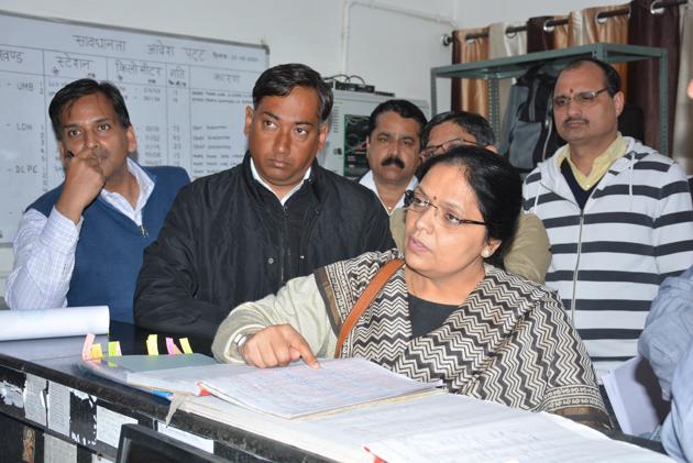 Principal safety officer Seema Kumar checking records of breathalyser tests of the running staff at the loco lobby of the Chandigarh railway station on Friday.(SANT ARORA/HT)