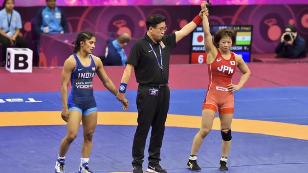 Japanese wrestler Mayu Mukaida (red) is declared winner against India's Vinesh Phogat after the women's 53kg quarterfinal bout during Asian Senior Wrestling Championship. (PTI) Japanese wrestler Mayu Mukaida (red) is declared winner against India's Vinesh Phogat after the women's 53kg quarterfinal bout during Asian Senior Wrestling Championship. (PTI)