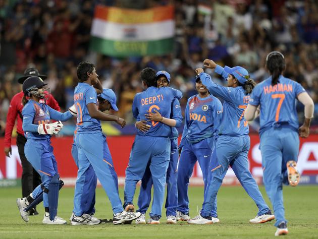 The Indian team celebrate the wicket of Australia's Ashleigh Gardner in the first game of the Women's T20 Cricket World Cup in Sydney. (AP)