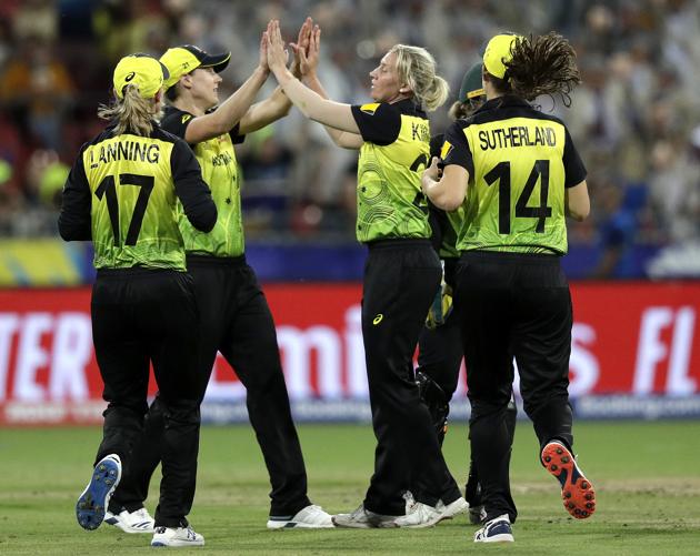 Australia's Delissa Kimmince, center, celebrates with teammates after trapping India's Jemimah Rodrigues LBW during the first game of the Women's T20 Cricket World Cup in Sydney. (AP)