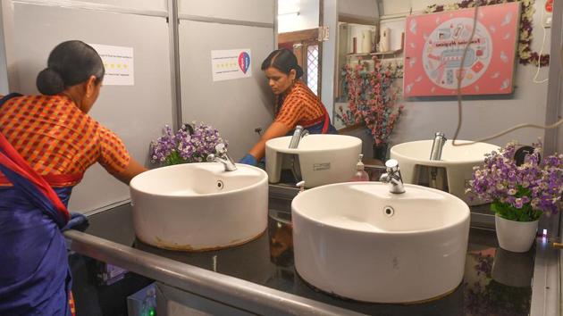 An attendant cleaning the interior of a mobile toilet on a bus at a public park. Even as India went on a building spree constructing millions of toilets as part of the “Clean India” programme, experts said the lack of water or electricity meant many remain unused. (Indranil Mukherjee / AFP) 