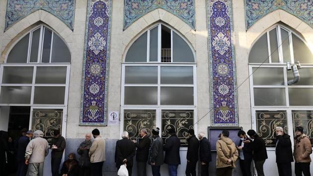 Iranians stand in queue to cast their vote at a polling station in the capital city of Tehran. Iran’s leadership and state media urged voter participation, with some framing it as a religious duty. (Associated Press) Iranians stand in queue to cast their vote at a polling station in the capital city of Tehran. Iran’s leadership and state media urged voter participation, with some framing it as a religious duty. (Associated Press)