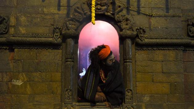 A Sadhu (Hindu holy man) looks on during the Hindu festival of Maha Shivaratri at the Pashupatinath Temple in Kathmandu, Nepal. (Prakash Mathema / AFP)
