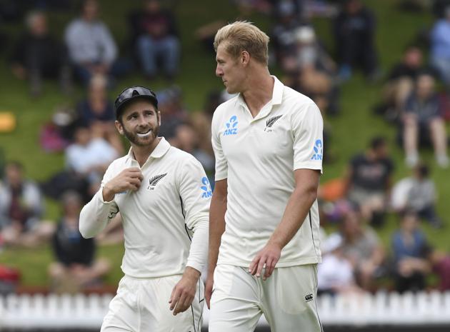 New Zealand bowler Kyle Jamieson, right, talks to captain Kane Williamson during the first cricket test between India and New Zealand at the Basin Reserve in Wellington (AP)