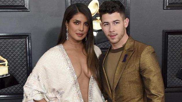 Priyanka Chopra, left, and Nick Jonas arrive at the 62nd annual Grammy Awards at the Staples Center.(AP)