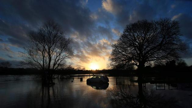 Flood water surrounds a car abandoned in a car park after the River Trent burst its banks, in Gunthorpe, Nottinghamshire, in central England, after Storm Dennis caused flooding across large swathes of the country. A man died after falling into a river and the army was drafted in to help deal with heavy flooding and high winds. (Lindsey Parnaby / AFP)