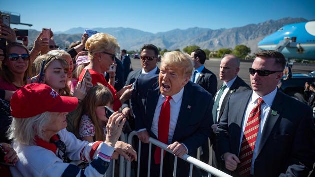 US President Donald Trump speaks with supporters as he arrives in Palm Springs, California, USA. (Jim Watson / AFP)