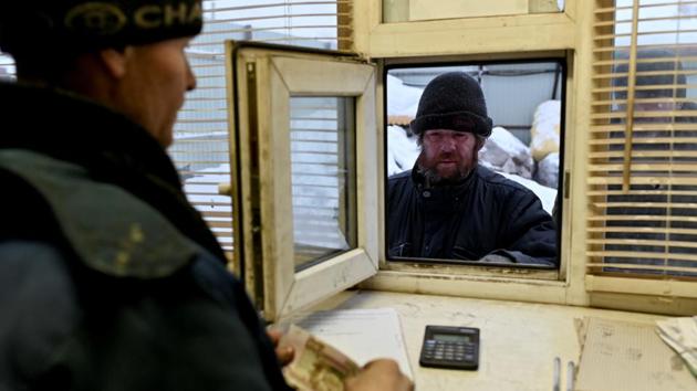 Alexei Vergunov waits to receive a payment in exchange for recyclable items that he brought to a recycling centre. Omsk, which lies three time zones east of Moscow, has a night shelter for the homeless. But it’s in a distant part of town and Vergunov doesn’t sleep there as the local homeless won’t let him earn his keep at the nearby rubbish dump on what they see as their patch. (REUTERS)