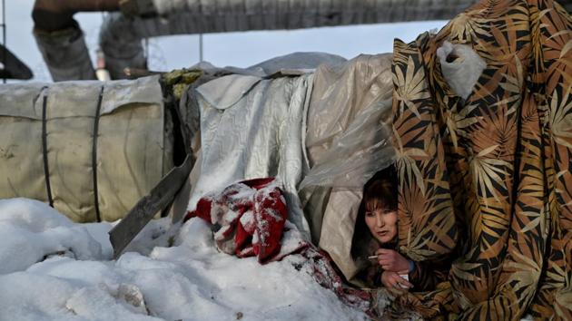 Galiya, 29, looks out from Alexey's makeshift shelter. Stepanova is now in a rehabilitation centre 30 kilometres out of town in the village of Rozovka. “I plan to go home, to mother,” she said, though she recognises she cannot turn back the clock on 27 years on the street. “My childhood dreams were noble, but it’s too late now, that boat has already sailed.” (REUTERS)