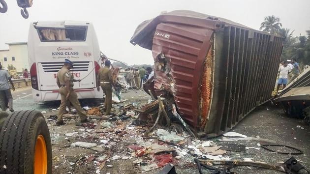 Policemen inspect the mangled remains of a Kerala State Road Transport Corporation bus which collided head-on with a container lorry near Tamil Nadu's Avinashi town, in Tirupur district, 40 kms from Coimbatore, Tamil Nadu. As many as 48 passengers were on board the bus that was proceeding to Ernakulam from Bengaluru. At least 20 were killed. (PTI)