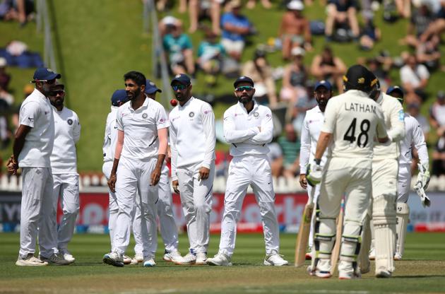 India's Virat Kohli with teammates watch the replay of a play on the stadium screen during the first cricket test between India and New Zealand at the Basin Reserve. (REUTERS)
