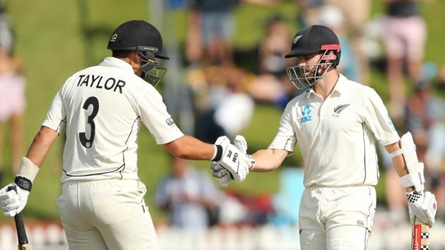 New Zealand's Kane Williamson celebrates his half century with Ross Taylor. (REUTERS)