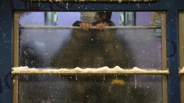 A commuter rides a tram during a snow storm in Sapporo. “Previous years, we’ve had three, four meters of snow,” he said. “Where we are standing now, last year we were a metre higher. We are now standing one metre lower.” (Jae C. Hong / AP)