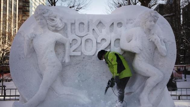 A worker blows fresh snow off a snow sculpture celebrating Sapporo’s hosting of Tokyo 2020’s marathon and race walk. After two months of almost no snow, Japan’s northern city of Sapporo was overwhelmed with the white stuff. Earlier this month, about 14 inches fell in just six hours following the nearly barren months of December and January. (Jae C. Hong / AP)