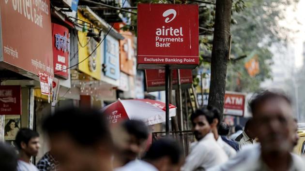 Signage for Bharti Airtel Ltd. stands outside a mobile phone store in Mumbai.(Bloomberg)