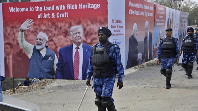 Paramilitary personnel patrol past a billboard featuring US President Donald Trump and Prime Minister Narendra Modi, erected to welcome Trump in Agra. (AP) Paramilitary personnel patrol past a billboard featuring US President Donald Trump and Prime Minister Narendra Modi, erected to welcome Trump in Agra. (AP)