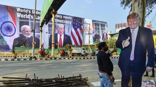 A worker arranges billboards of U.S President Donald Trump, near Taj Mahal ahead of US President Donald Trump’s maiden visit to in Agra. (PTI Photo) A worker arranges billboards of U.S President Donald Trump, near Taj Mahal ahead of US President Donald Trump’s maiden visit to in Agra. (PTI Photo)