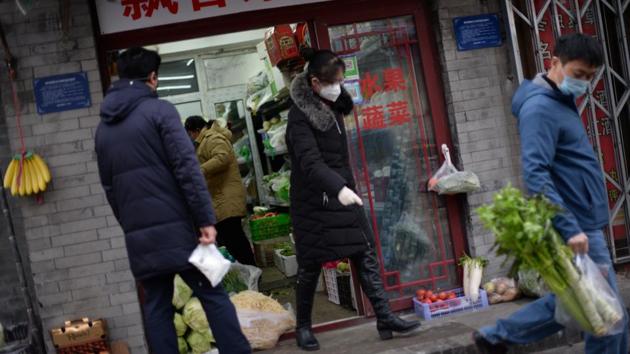 Residents buy food at a greengrocer’s. JD.com saw a 215% spike in fresh food sales over the Lunar New Year, while Meituan Grocery’s daily sales in Beijing tripled at its peak during the holiday. Li estimates “a few hundred” Yunhaiyao staff have taken on short-term work with supermarkets or online platforms. Cai added Cindy Cafe was in talks to help workers find temporary employment. (Tingshu Wang / REUTERS)